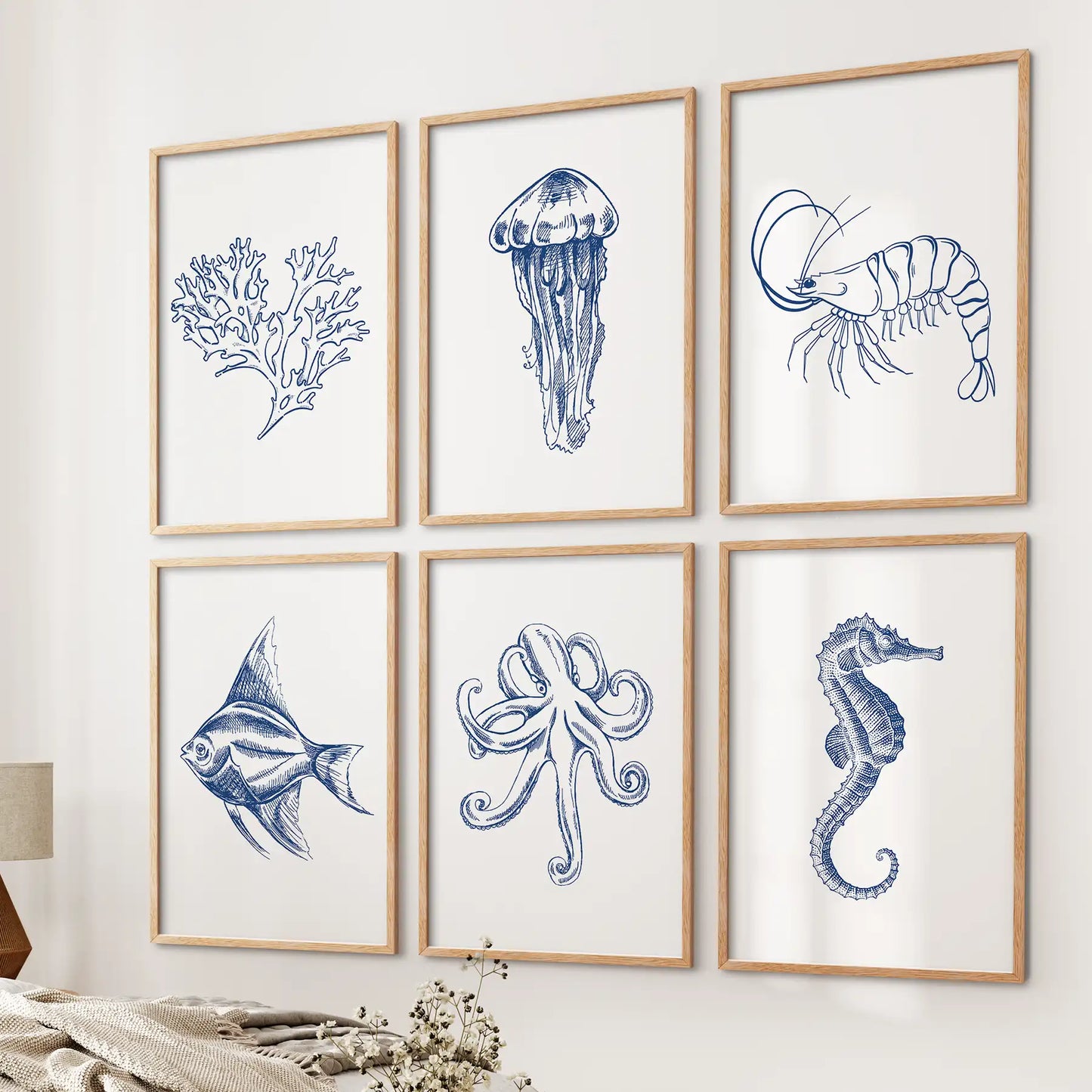 Sealife poster coastal wall decor. Blue sea animals home decor. Wood frames over the bed.