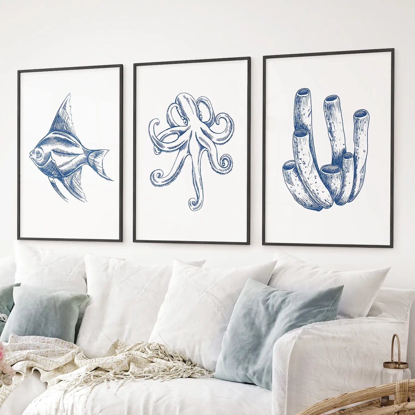Set of 3 piece modern nautical art posters. Neutral ocean art print decor. Black frames above the sofa.