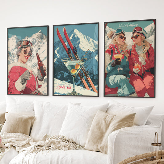 Après-ski retro art prints with skiers, martini glass, and alpine background. Black frames above the sofa.