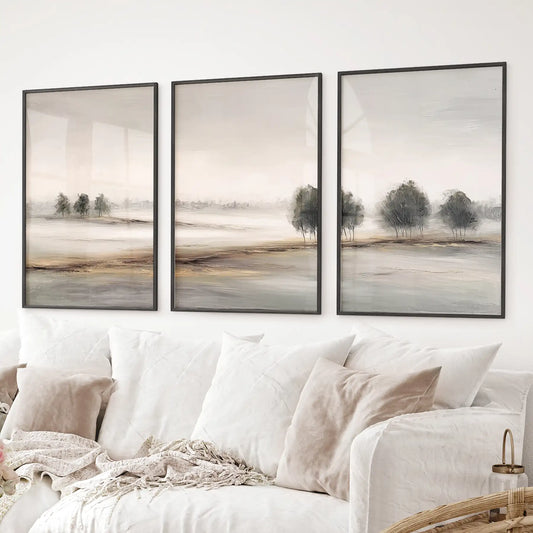 Modern farmhouse autumn landscape wall art set of 3. Beige and neutral autumn tree wall art set. Black frames over the couch.