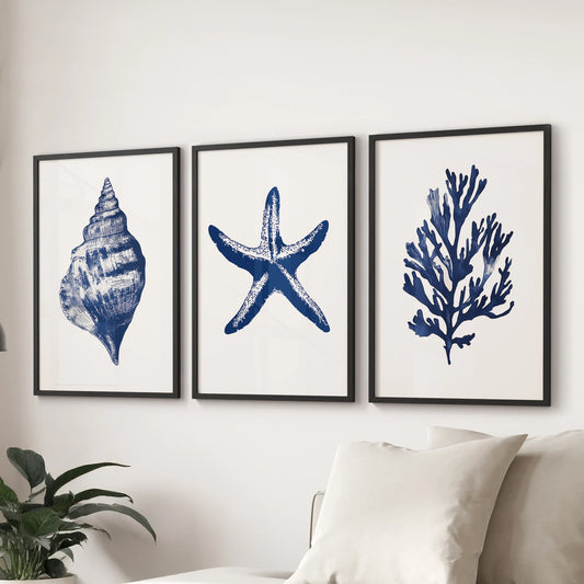 This wall art trio of coastal sea creatures in matte black frames rests above the sectional, grounding the family room with a seaside feel.