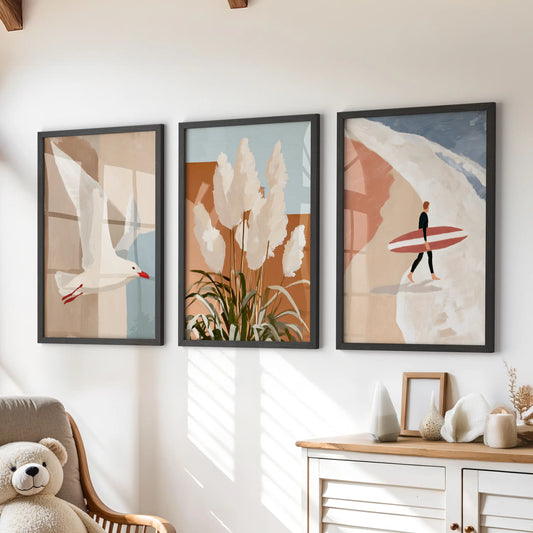 Surfer and breaking waves, a trio of black-framed prints, sits over the dresser to brighten the children’s room with playful coastal wall art.