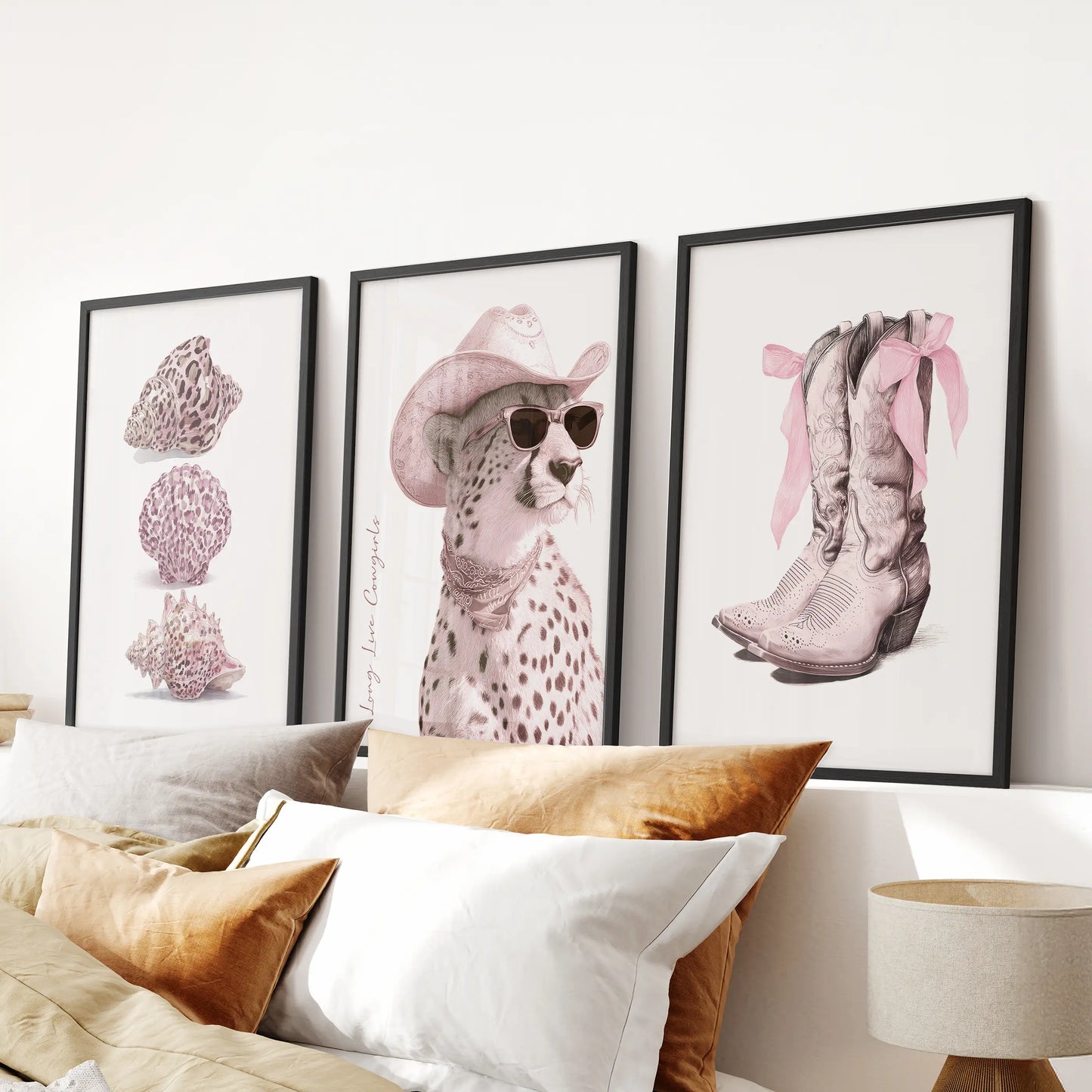 A trio of cowgirl boots and bows prints in sleek black frames crowns the bed, bringing playful Western flair to the bedroom decor.