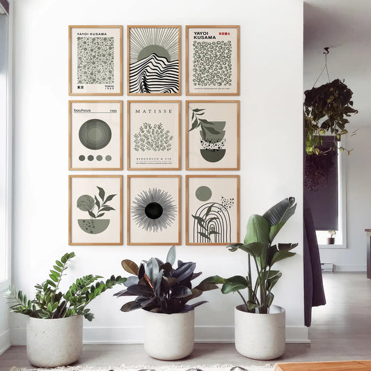 Modern minimalist gallery wall with 9 art posters in black, beige, and green tones with geometric and botanical shapes. Thinwood frames for apartment.