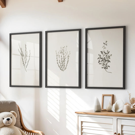 Dried wildflowers wall art set of three in black frames sits over a playroom chest of drawers, bringing soft, rustic texture to a clean space.