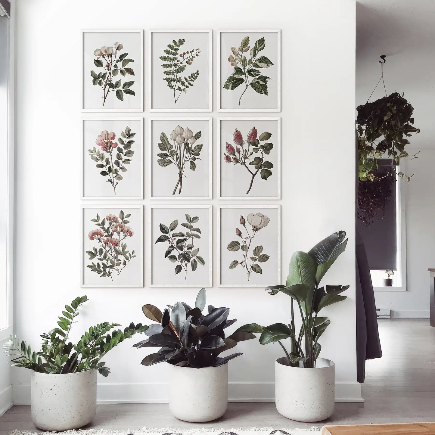 Floral watercolor print set of 9 piece. Botanical gallery vintage flowers prints. White frames in neutral interior.