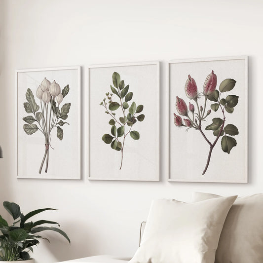 Vintage botanical flower illustrations in a three-piece picture set float over the family-room couch, the white-framed prints tying together rustic and modern notes.