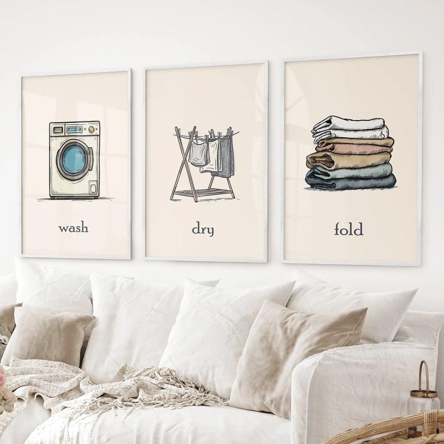 Wash Dry Fold laundry room decor set washing machine, clothesline, folded clothes. White frames above the sofa.