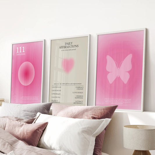 Pink aura gradient posters, trio, crown a pink bedroom over the headboard with light white-framed prints for soft, upbeat color.