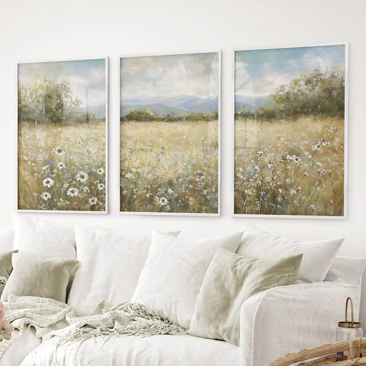 Rustic botanical landscape prints with golden grass and wildflowers. White frames for living room.