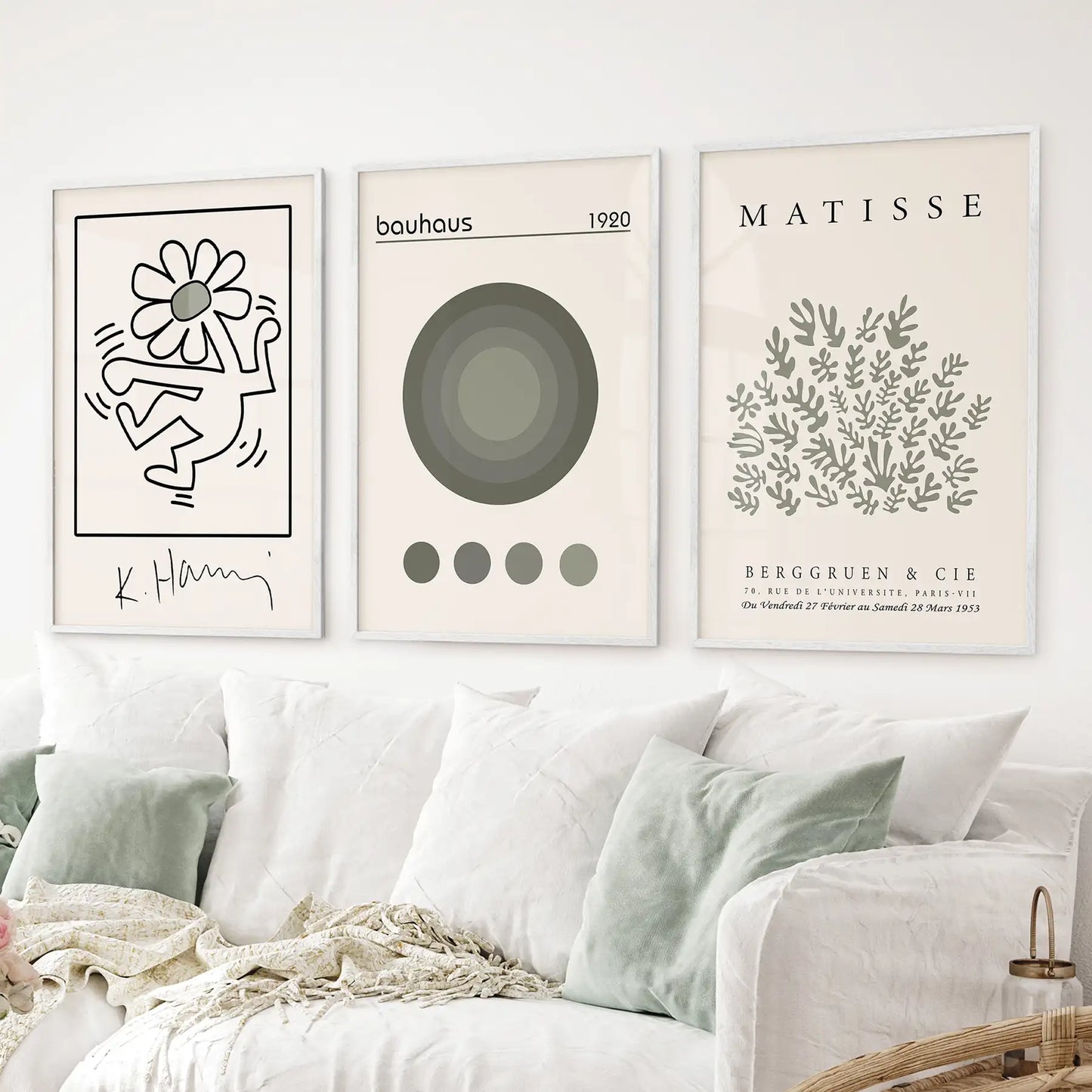 Sage green museum style art. Modern mid century wall art decor. White frames above the sofa.