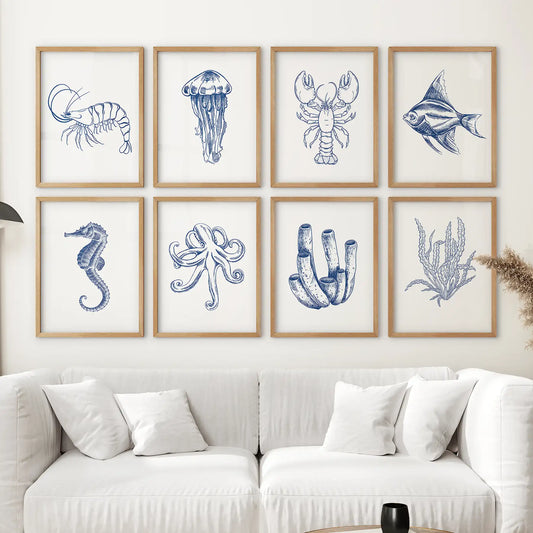 Coastal ocean wall art  8 prints marine life illustrations in navy blue, including fish, coral, and seaweed. Thinwood frames for living room.