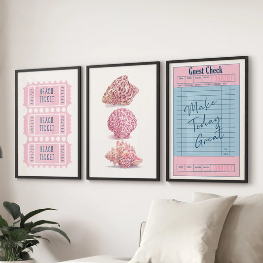 A modern 3-piece beach ticket wall art set in black frames adds a clean pop of pastel color above the lounge sectional sofa.