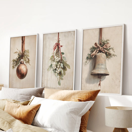 Farmhouse Christmas wall art, a 3-piece set in white frames, hangs in the bedroom over the headboard for an airy seasonal touch.
