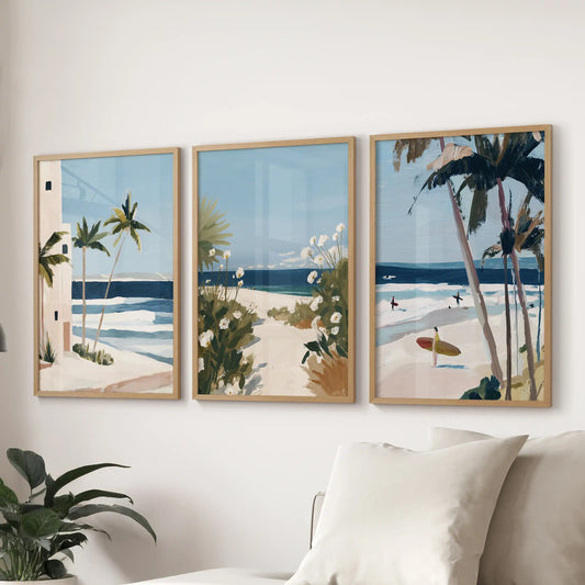 Surf waves gallery prints, a trio in oak wood frames, settle over the lounge sofa with motion and mist for a cool, coastal finish.