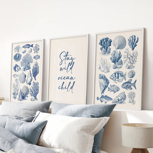 White-framed underwater animals print set of three introduces calm ocean hues in the blue bedroom above the headboard.