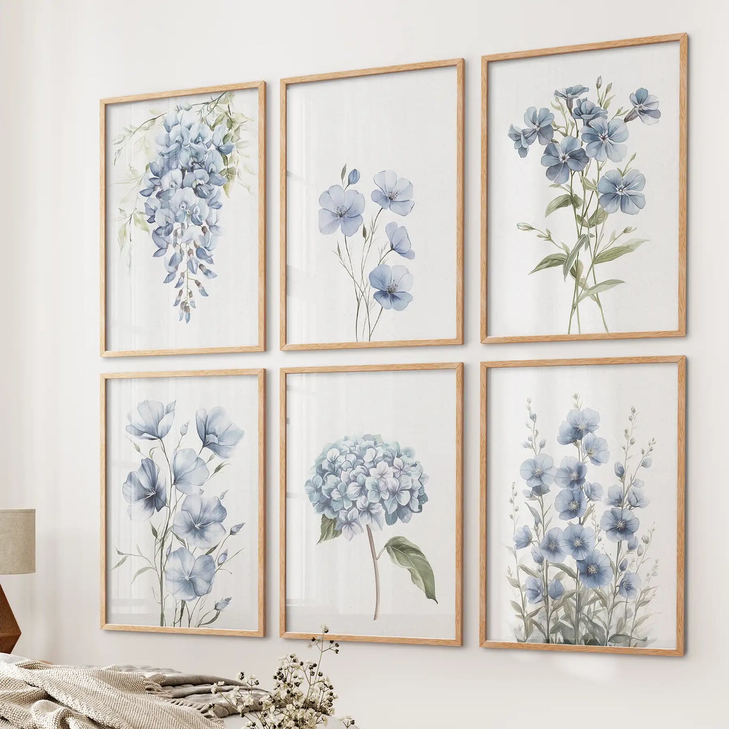 Gallery wall with six botanical flower prints in soft blue tones elegant decor. Thinwood frames for bedroom.