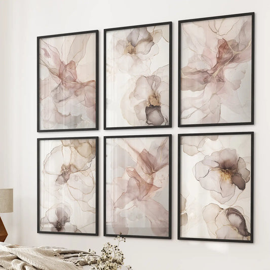 Minimalist watercolor paintings in beige and blush tones. Gallery abstract posters. Black frames over the bed.