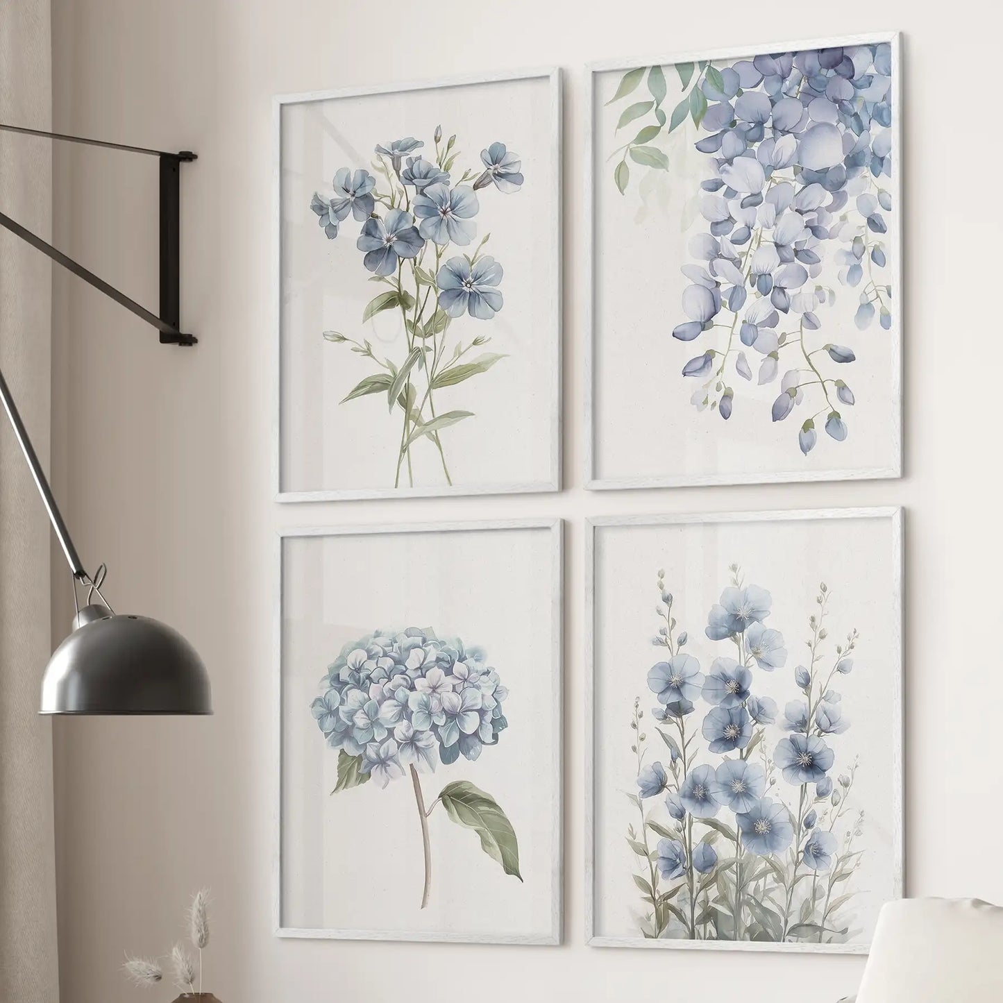 Set of 4 blue botanical wall art prints with hydrangea, flax, and wisteria flowers. White frames over the couch.