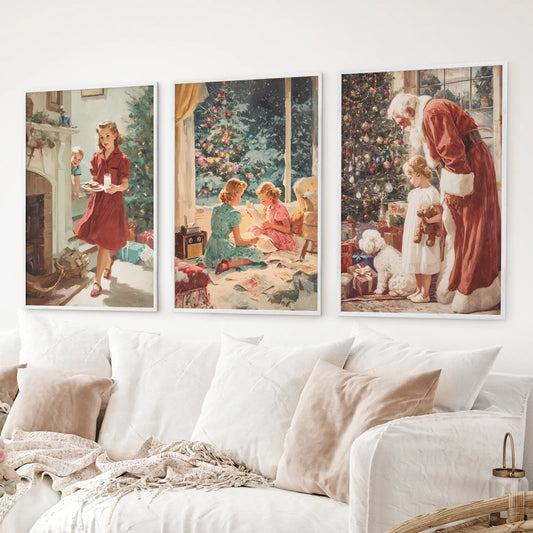 Cozy holiday wall art trio – Santa by the tree, children with toys, and festive living room scenes. White frames above the sofa.