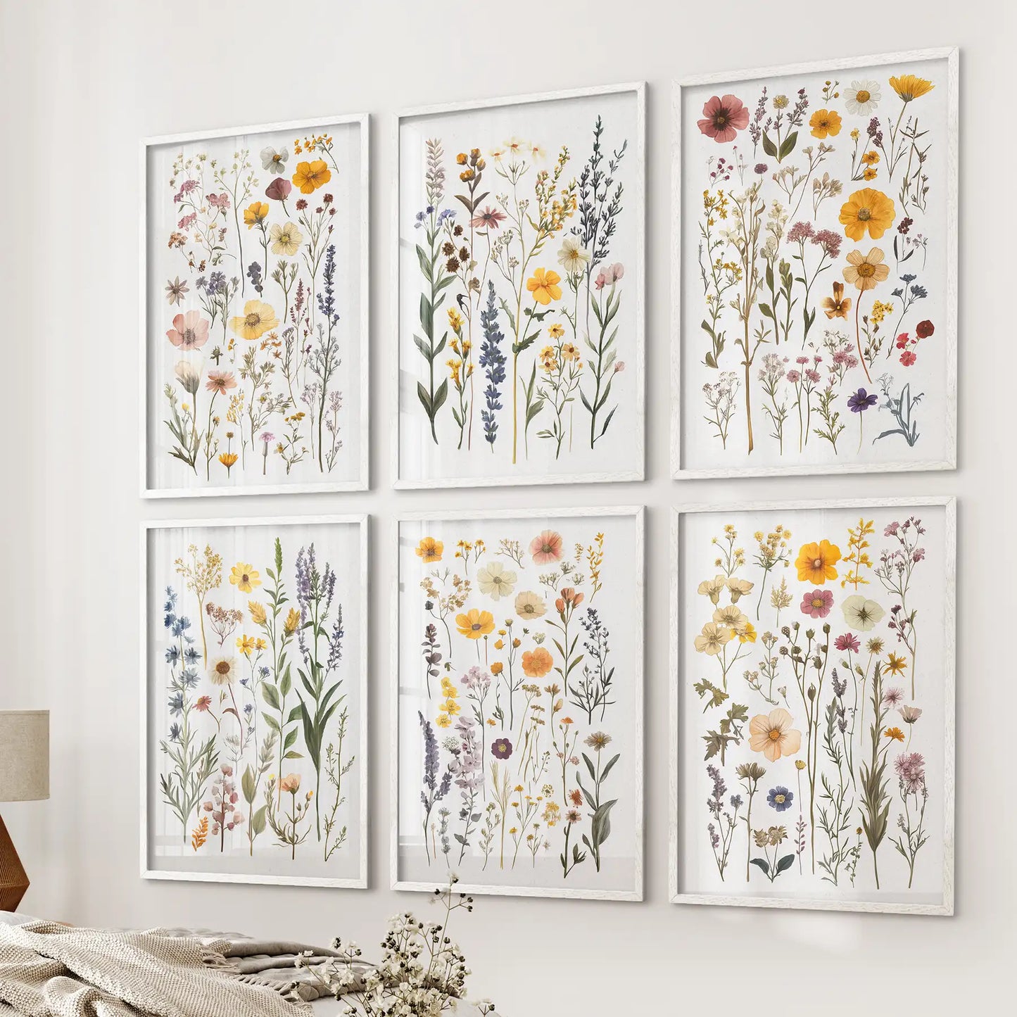 Botanical wall art set of 6 prints featuring colorful wildflowers on a neutral wall. White frames for bedroom.