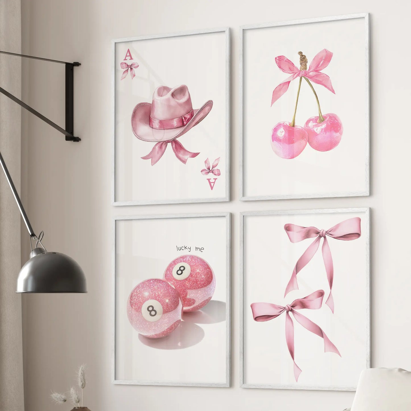 8 ball motif wall art, four-piece set, hangs above the sofa in the lounge with crisp white frames and a retro pink tone that nods to playful coquette style.