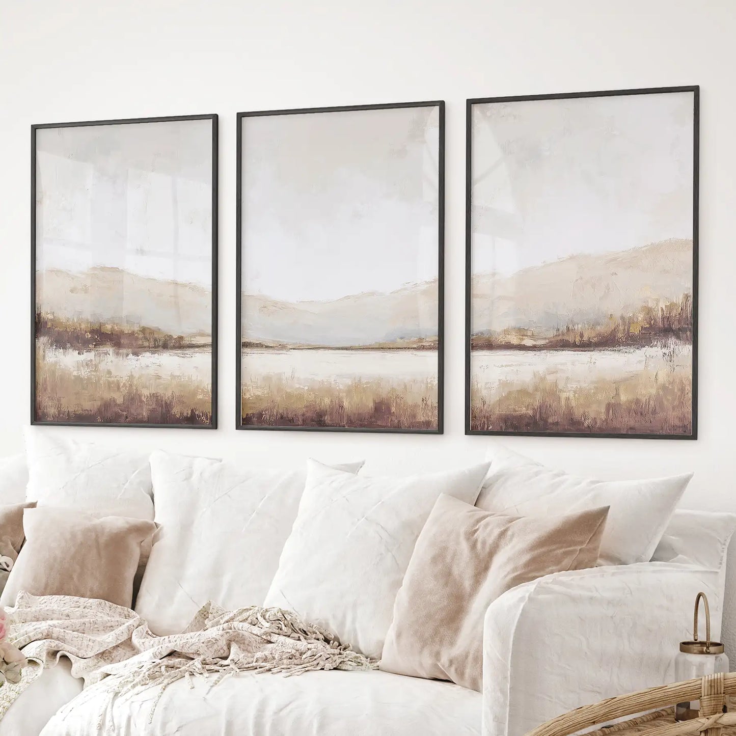 Minimalist landscape triptych prints with mountains and field in warm earthy colors. Black frames for living room.