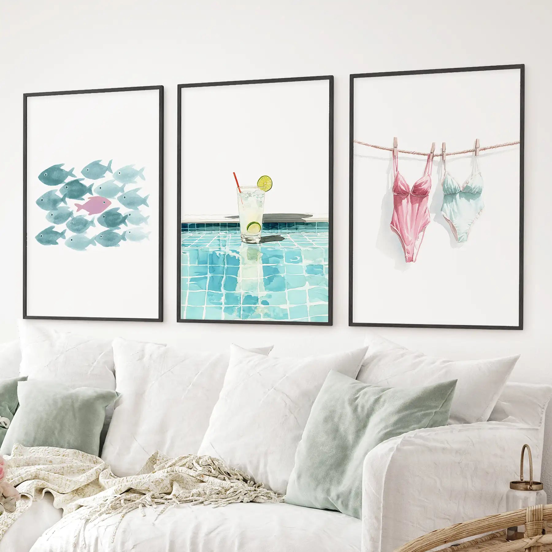 Playful summer themed art 3 prints watercolor prints of aquatic and poolside elements. Black frames above the sofa.