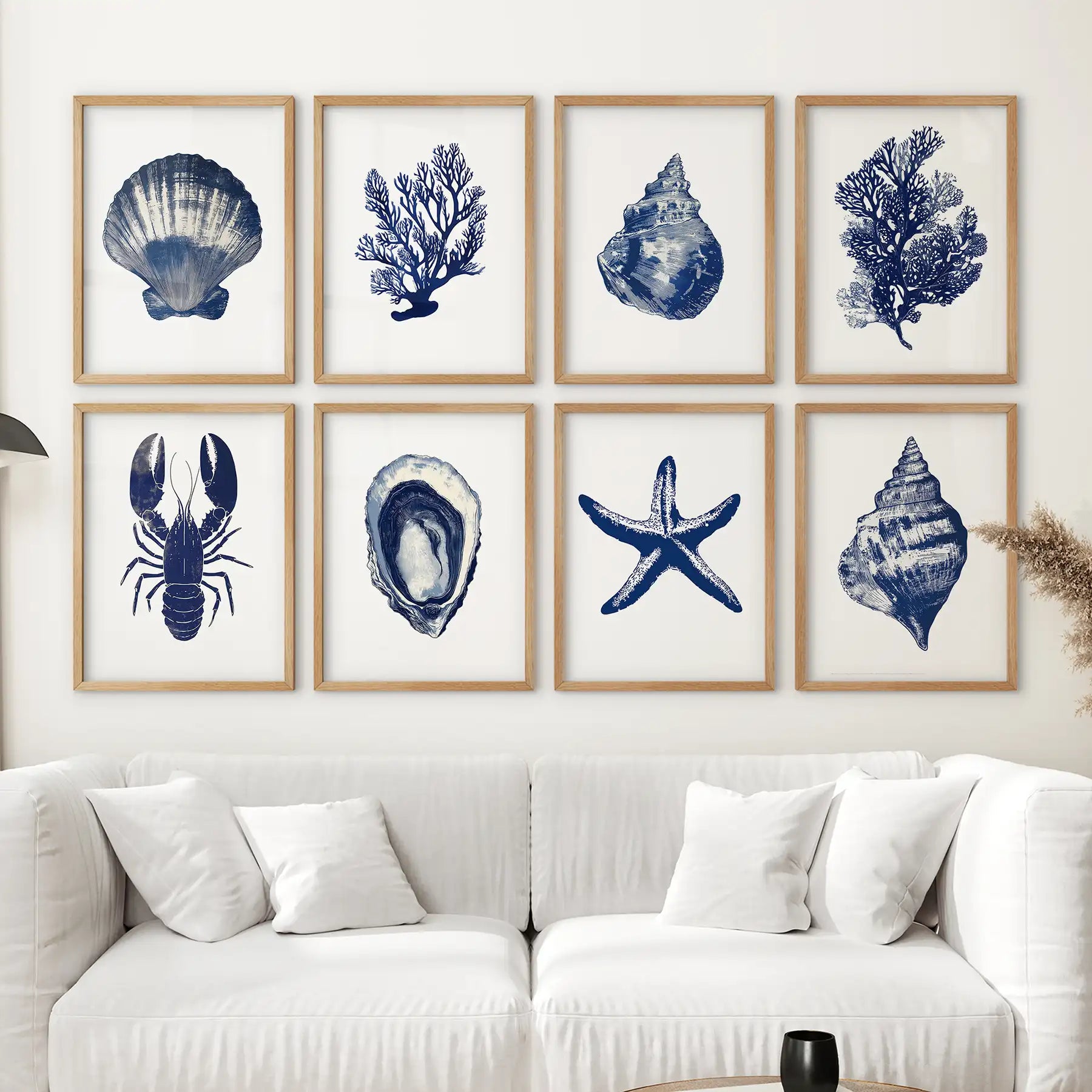 Seaweed, starfish, shell, lobster room decor. Modern watercolor marine set of 8 piece. Thinwood frames over the couch.
