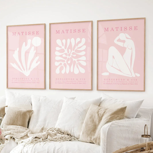 Modern abstract pink prints inspired by Matisse for stylish home decor. Thinwood frames over the couch