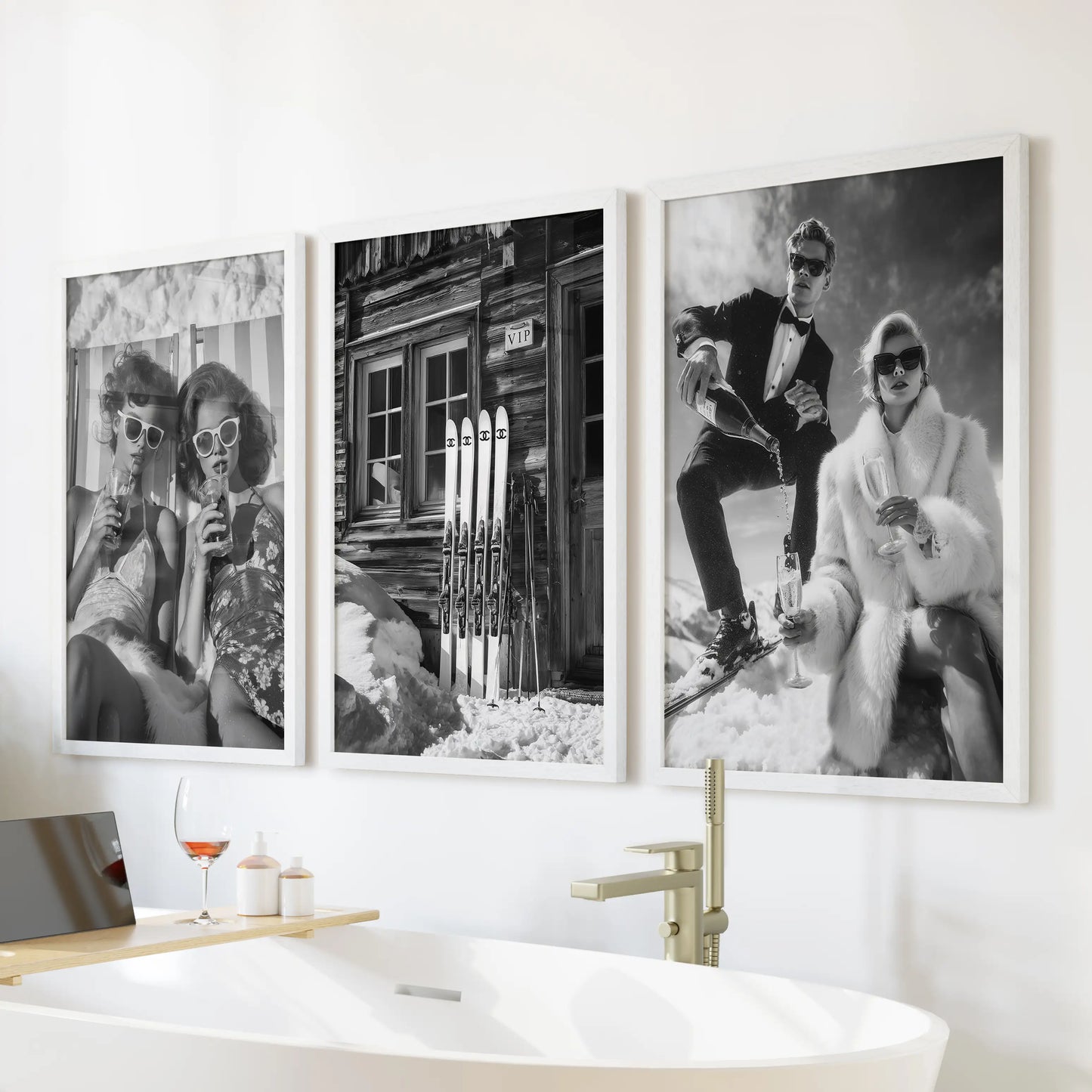 Après-ski beverages, a wall art trio in white-framed prints, float above the soaking tub and lend a fresh, wintry note to the bathroom.