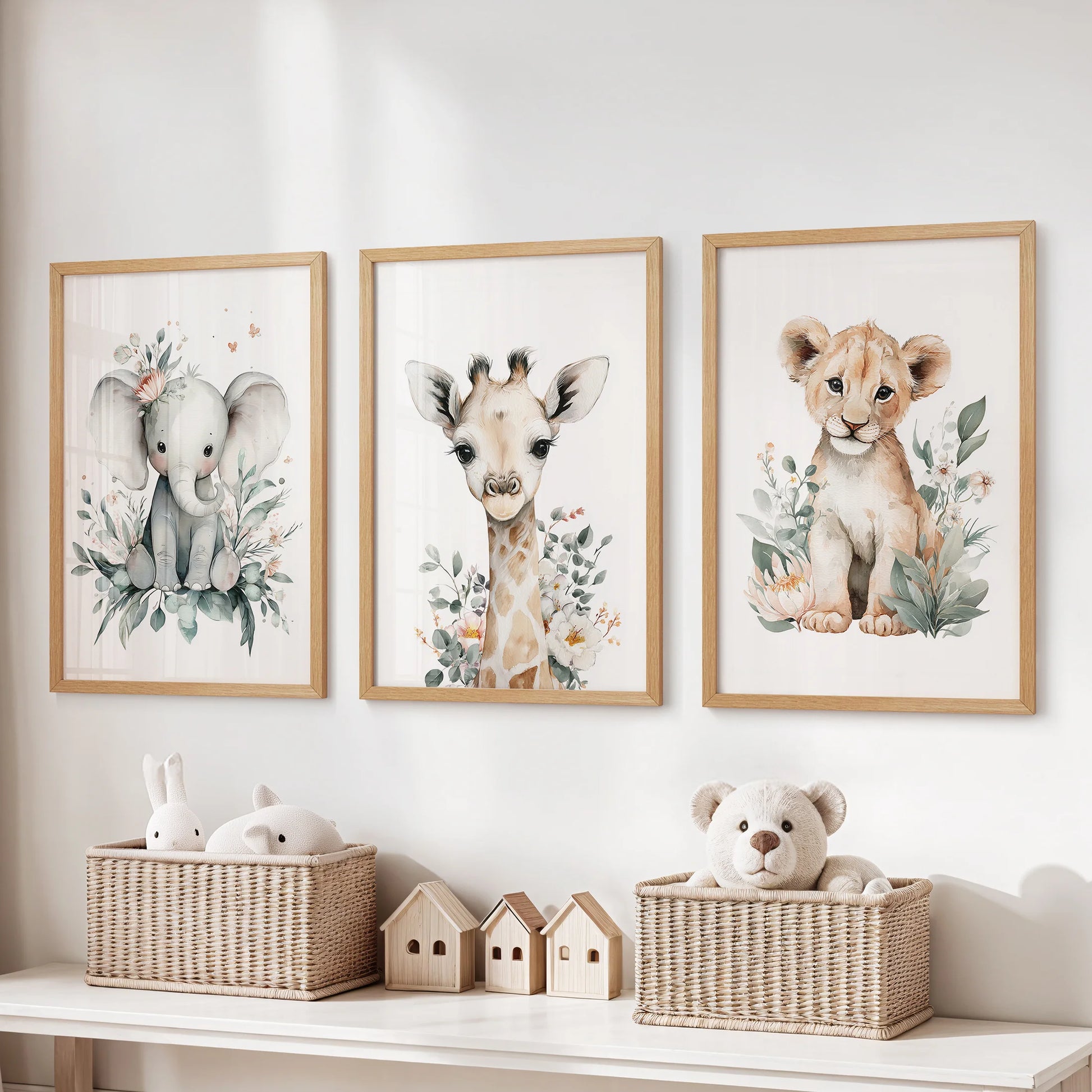 Set of three safari animal wall prints in warm natural wood frames, a cozy touch for the kids playroom displayed over the toy storage bench.