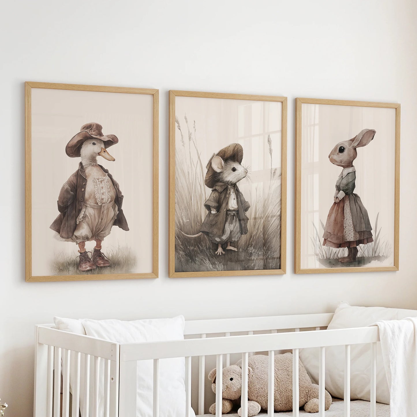 Cute mouse wall art, 3-piece artwork in natural wood frames, placed above the bassinet in the nursery with coordinating vintage goose and rabbit.
