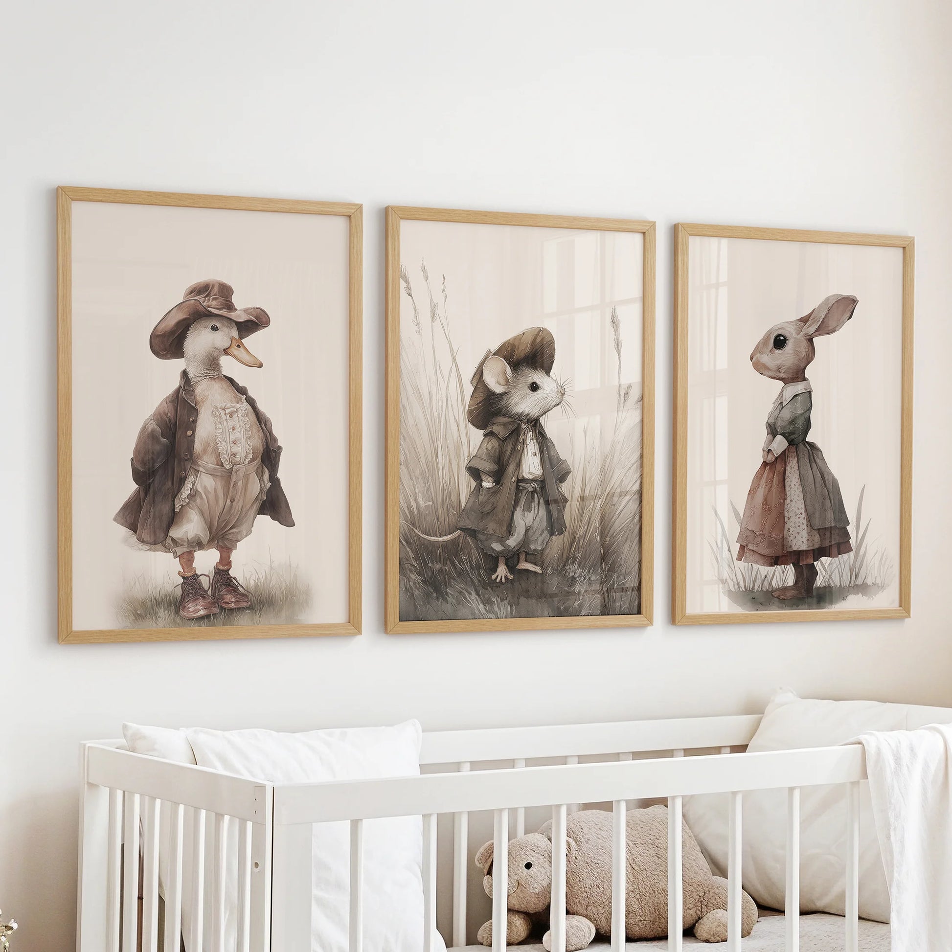 Cute mouse wall art, 3-piece artwork in natural wood frames, placed above the bassinet in the nursery with coordinating vintage goose and rabbit.