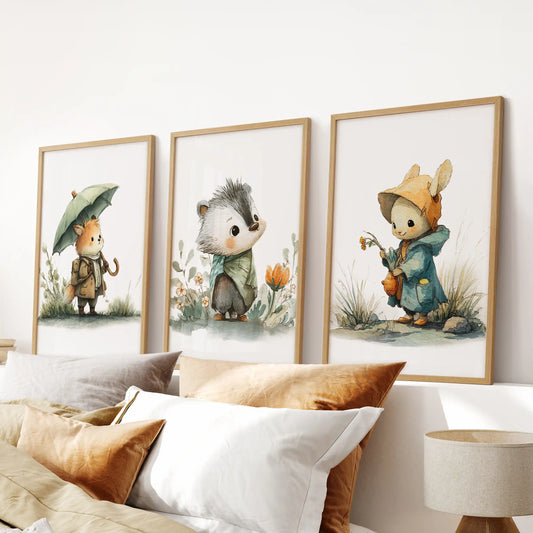 Forest animal nursery prints poster set of three in warm wood frames for the bedroom, centered above the headboard.