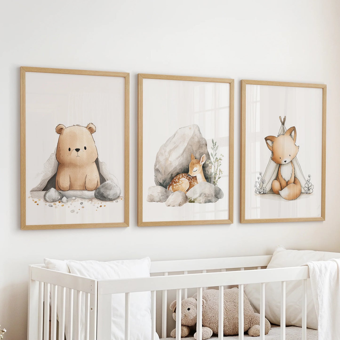 Baby animal portraits wall art, a three-piece set in warm wooden frames, hangs gently above the cot to bring hush and wonder to the nursery.