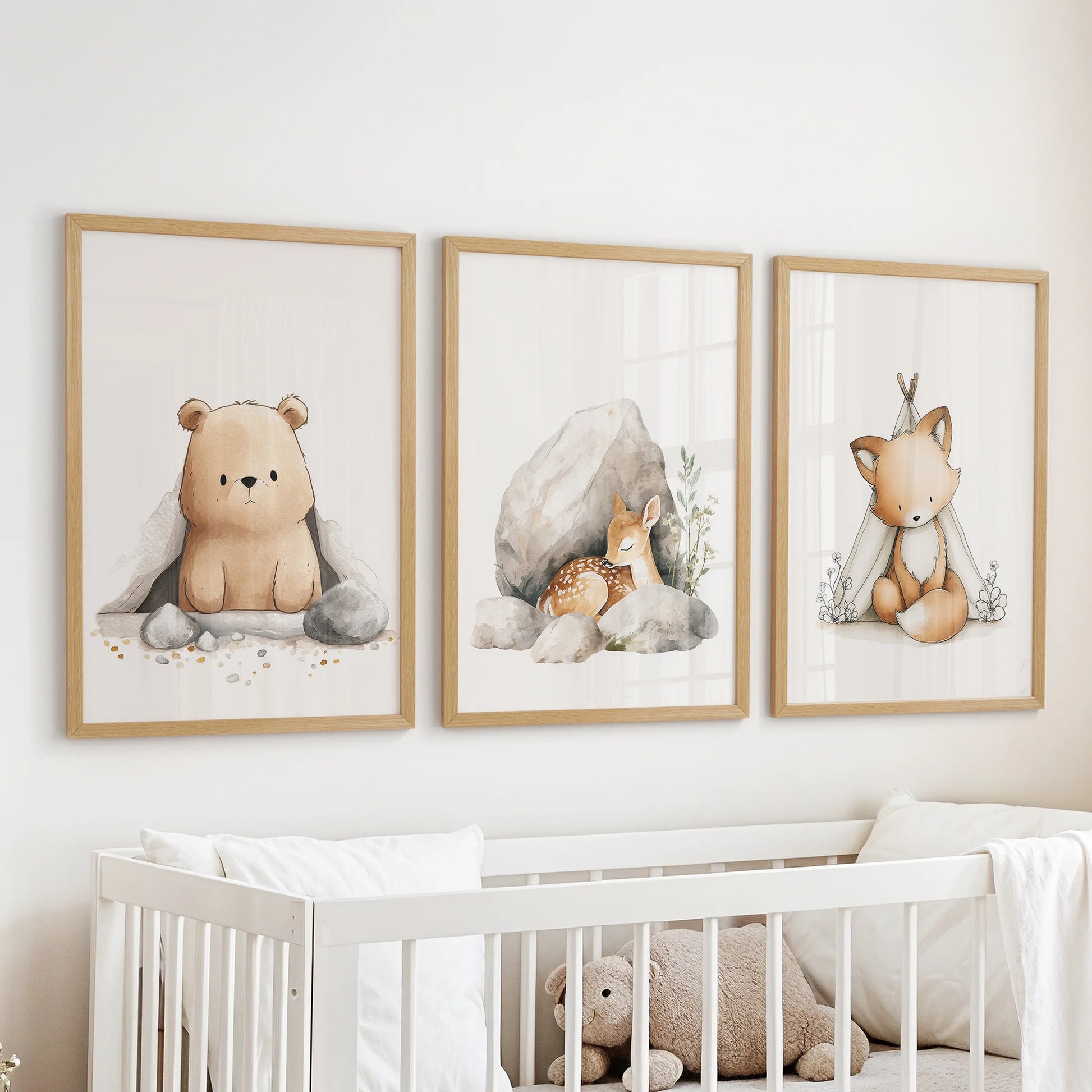 Baby animal portraits wall art, a three-piece set in warm wooden frames, hangs gently above the cot to bring hush and wonder to the nursery.
