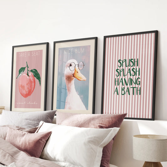 Funky washroom wall art, a 3 print bundle in black framed prints, styled above the bed to bring playful color into a pink bedroom.