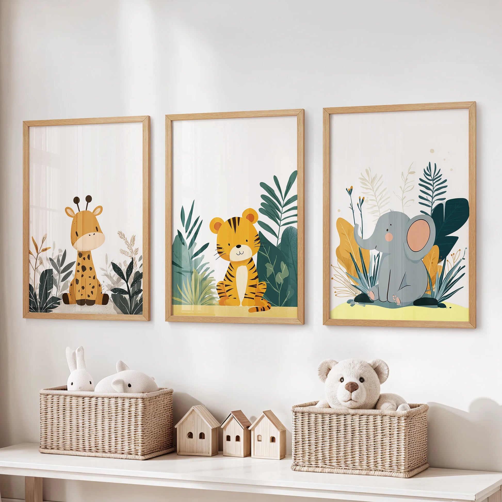Gender-neutral nursery animals wall art trio, framed in warm natural wood, hangs in the kids playroom above the toy organizer.