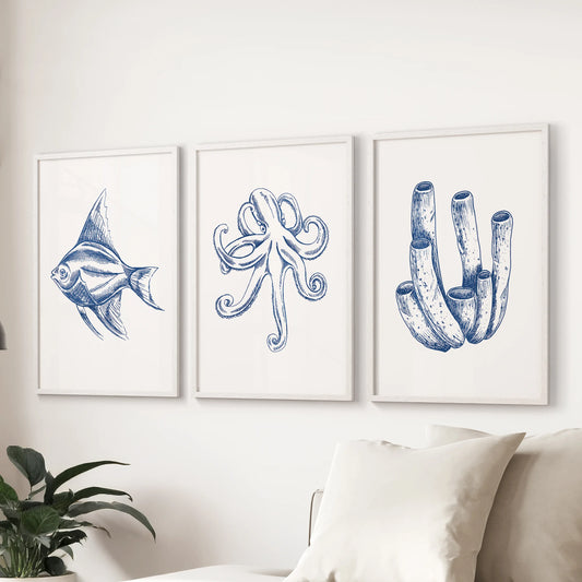 Octopus illustrations three-piece picture set in white frames, styled in the family room above the sectional sofa for a fresh, coastal focal wall.