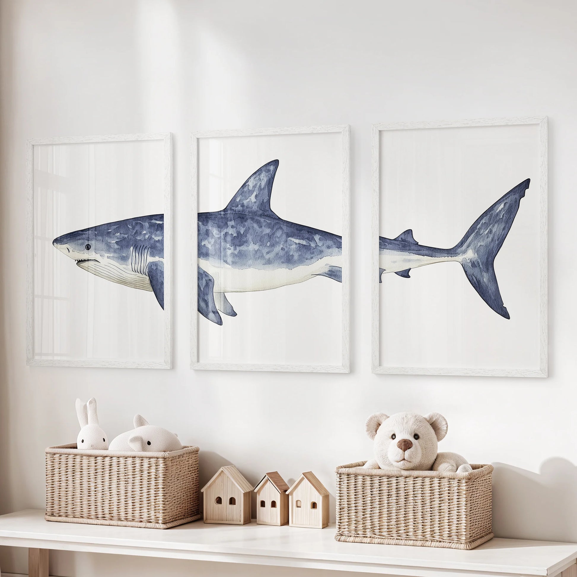 Beach house coastal shark art, a wall hanging set of three, arrives in bright white frames for the playroom, styled to hang over the toy organizer.