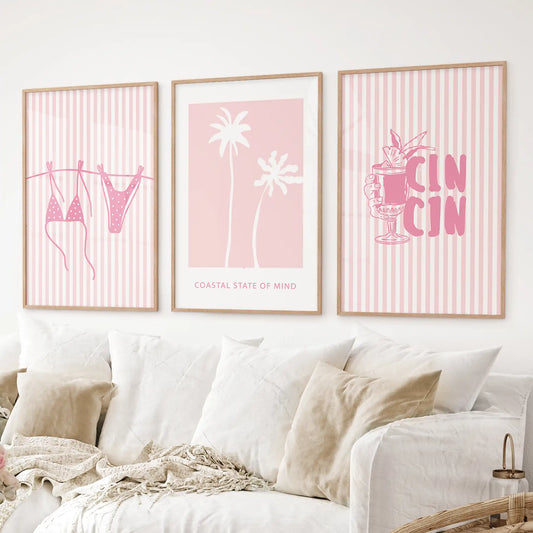Beachy pink wall art set with playful summer designs in white and blush tones. Thinwood frames over the couch