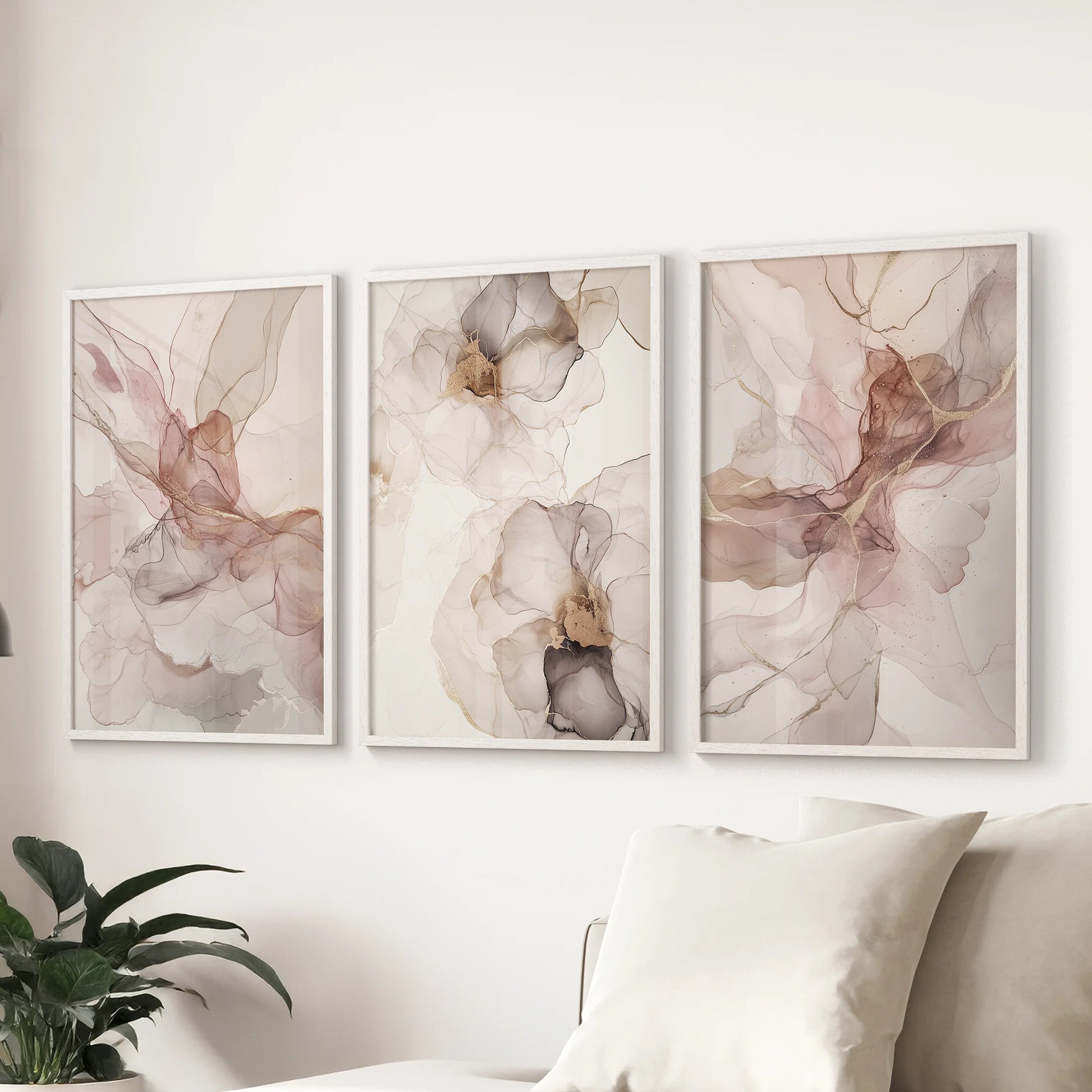 Beige and pink abstract wall hanging set of 3, shown as white-framed prints above the sitting-room couch for a soft, cohesive accent.