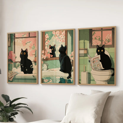 Japanese-style cat on a toilet, a gallery of three prints in natural oak frames, completes lounge wall art arranged neatly behind the couch.