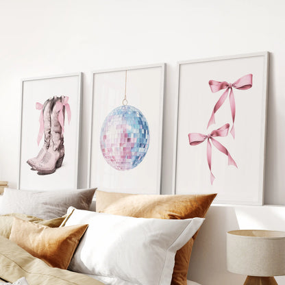 This three-piece white-framed bow art set accents a pink bedroom wall above the headboard with a clean, preppy sweetness.