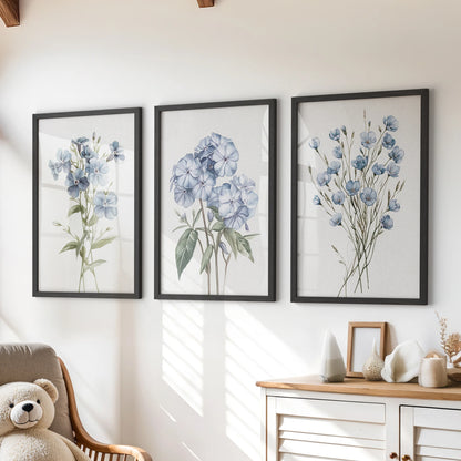 Watercolor wildflowers, a poster set of three in black frames, brighten a kids room above the chest of drawers as airy wall art.