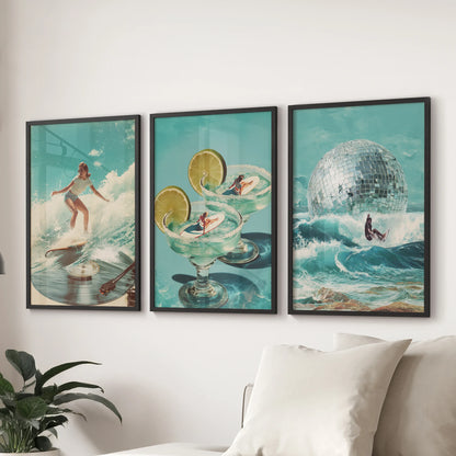 Three black-framed prints of blue ocean waves sweep across the lounge wall behind the couch, adding a cool coastal rhythm to the space.