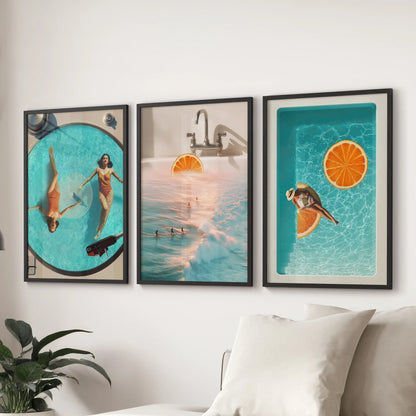 Trendy beach graphics wall art, a 3-piece set, pop in black framed prints behind the lounge sofa, threading blue and orange through the room.