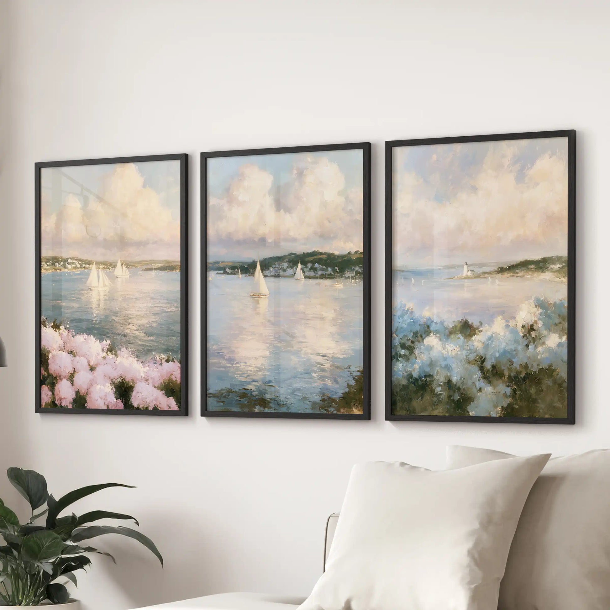 Hydrangea beach flowers three piece wall decor set lines the lounge wall over the sectional sofa, each in a black frame with soft blue and pink blooms.