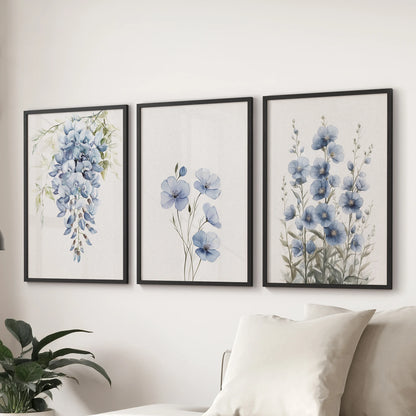 A trio of blue watercolor floral wall art prints in black frames hangs above the sectional sofa, freshening the lounge with crisp botanical detail.